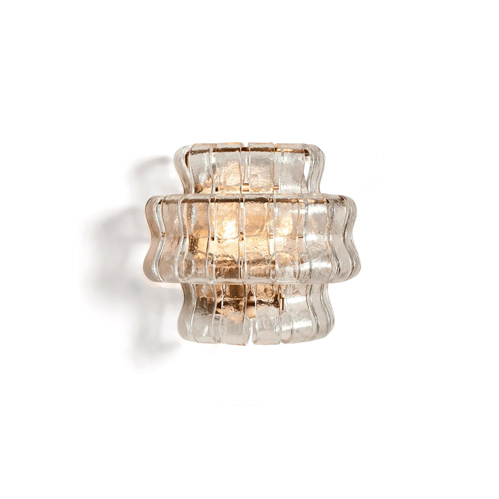 Decorative wall light fixture with ribbed glass on a white background