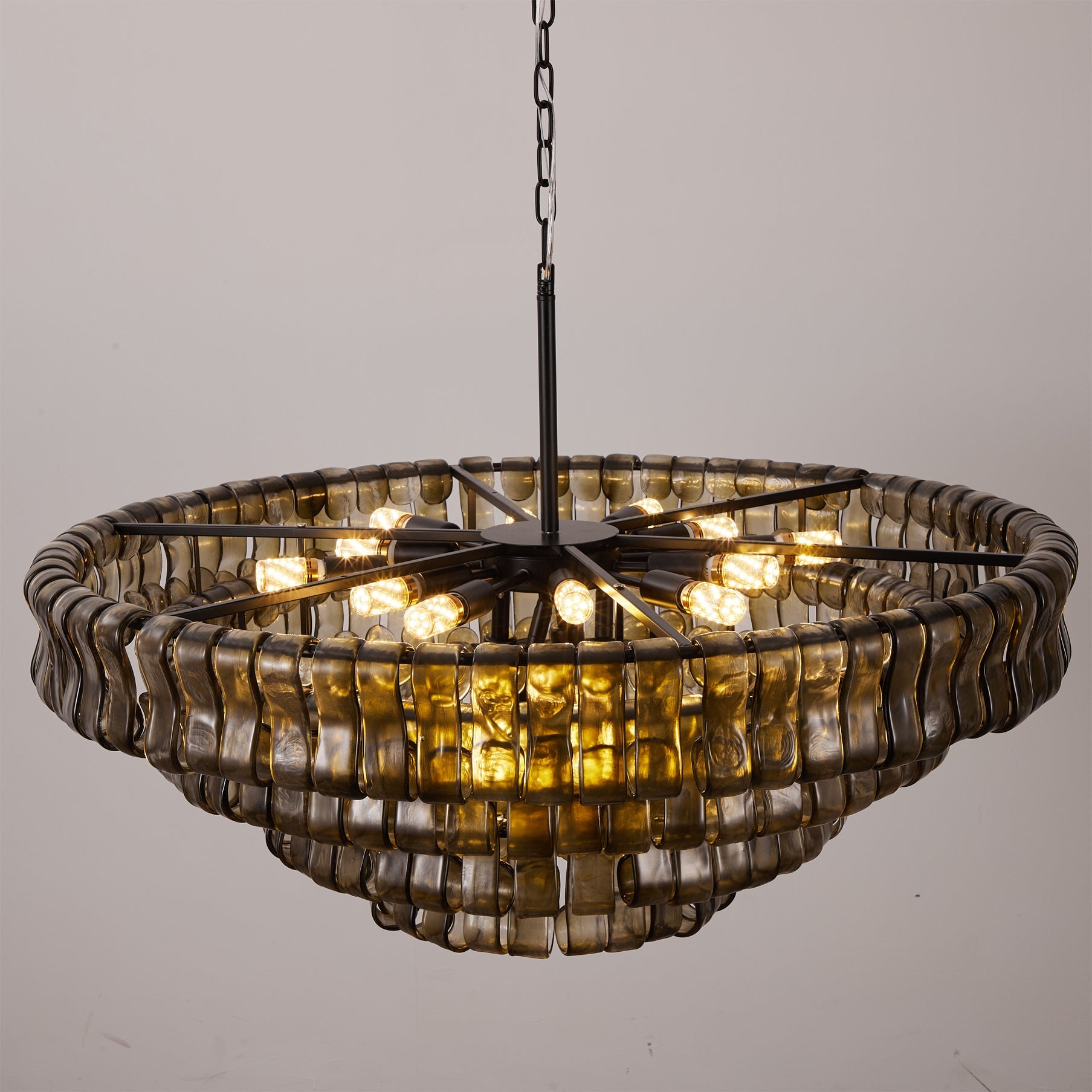 Decorative chandelier with glass shades on a gray background