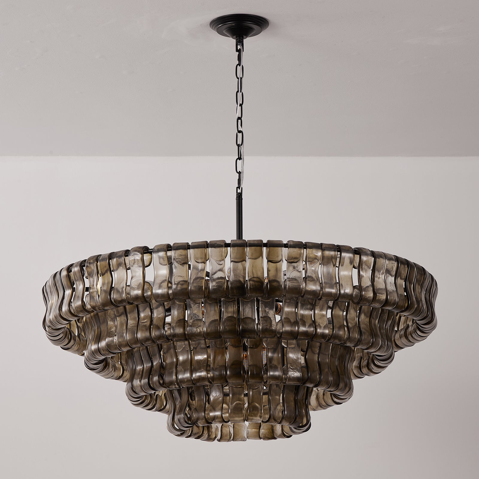 Decorative chandelier with ribbed design on a plain background