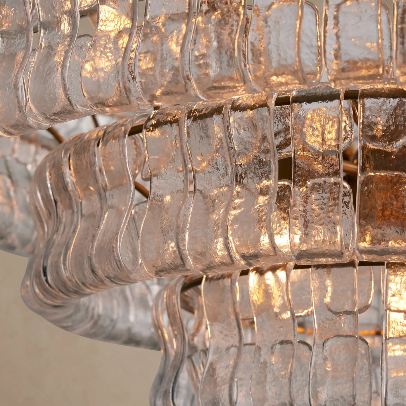 Close-up of a chandelier with clear glass shades.