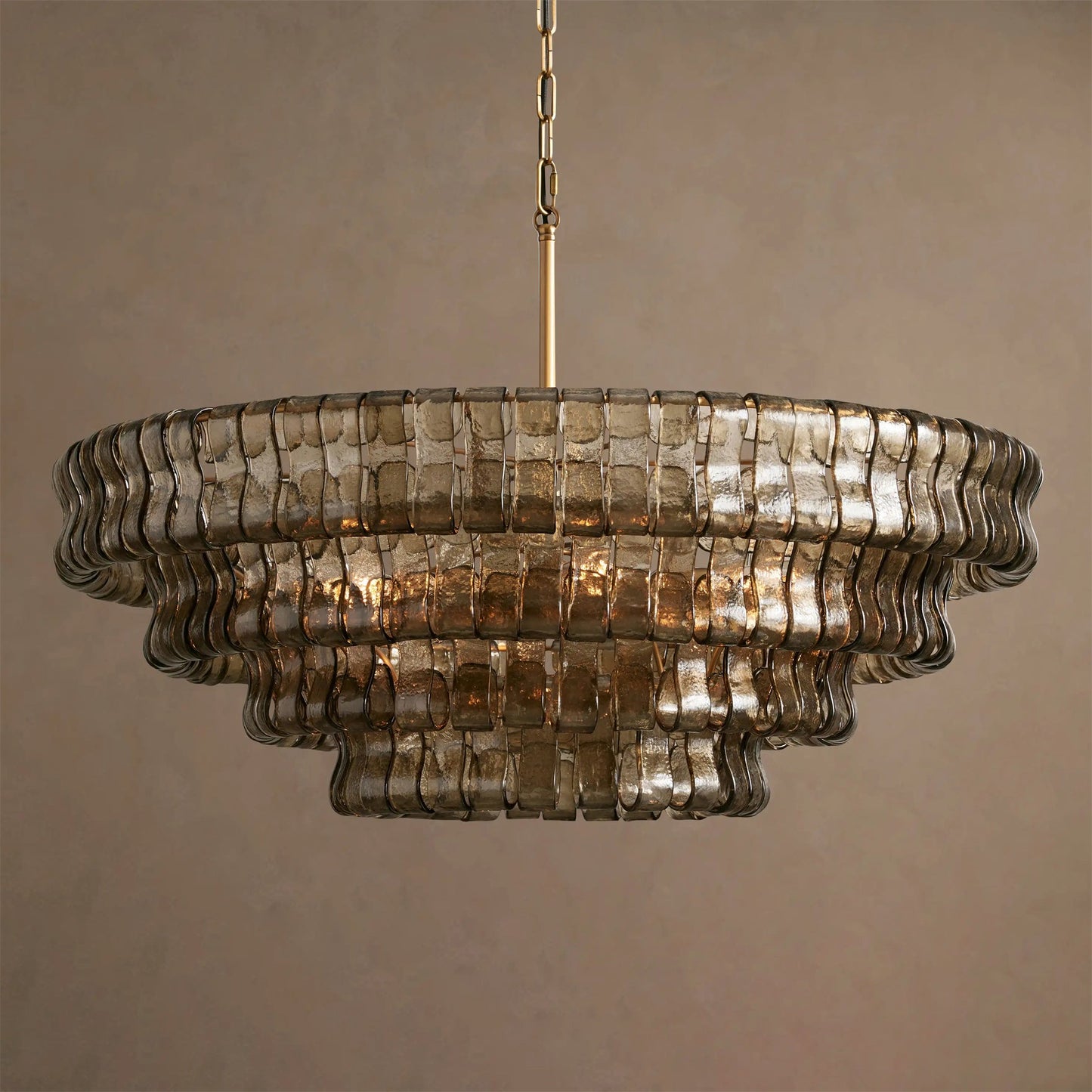 Decorative chandelier with ribbed glass design on a neutral background