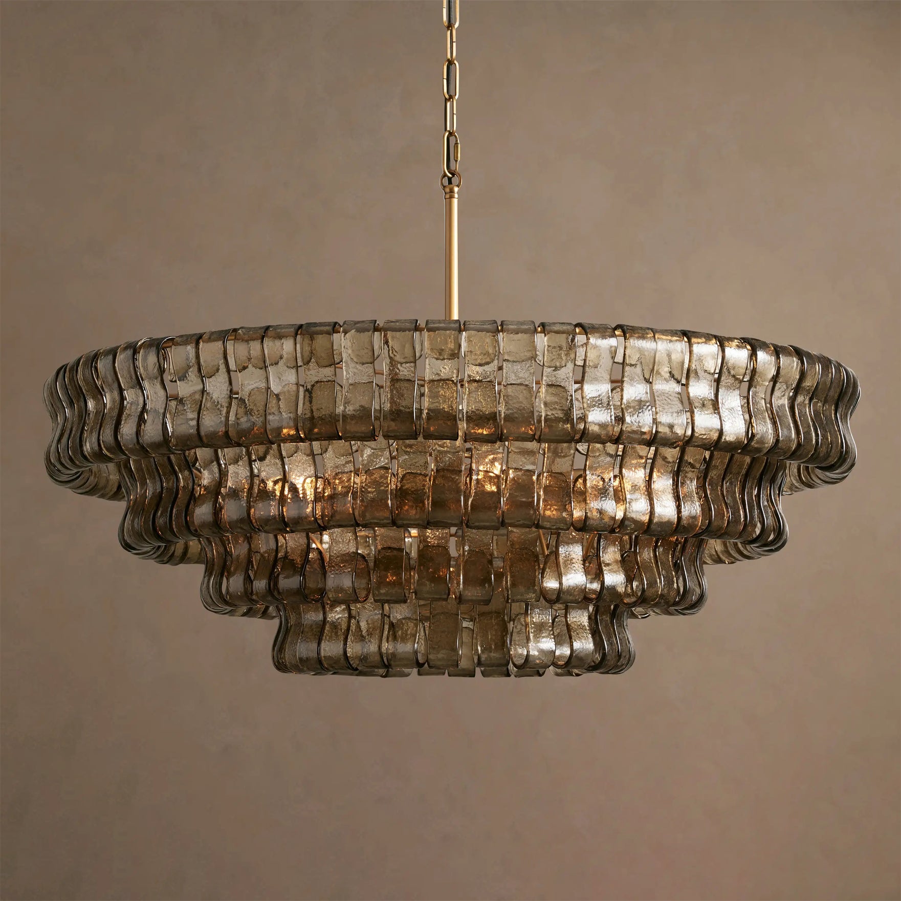 Decorative chandelier with ribbed glass design on a neutral background