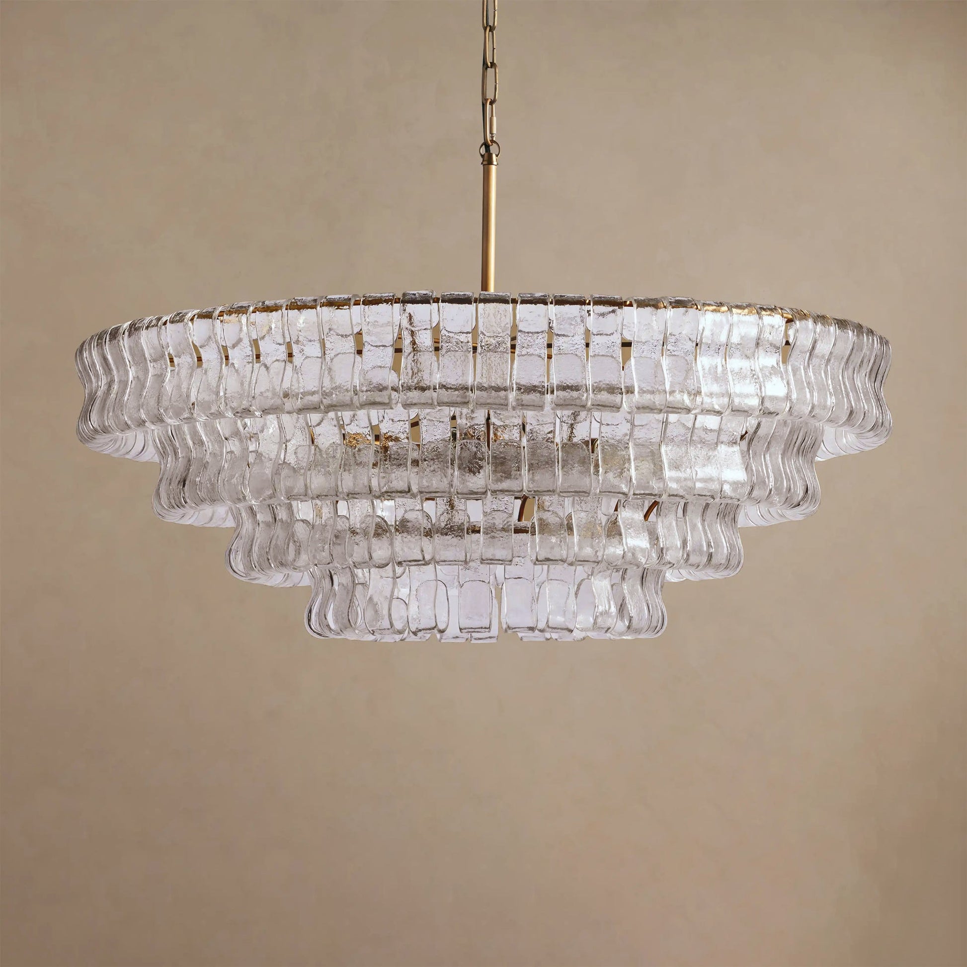 Chandelier with clear glass panels on a beige background