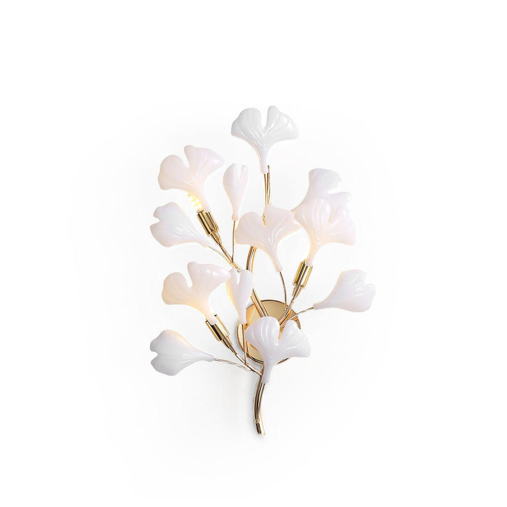 Decorative wall light fixture with white floral design on a white background