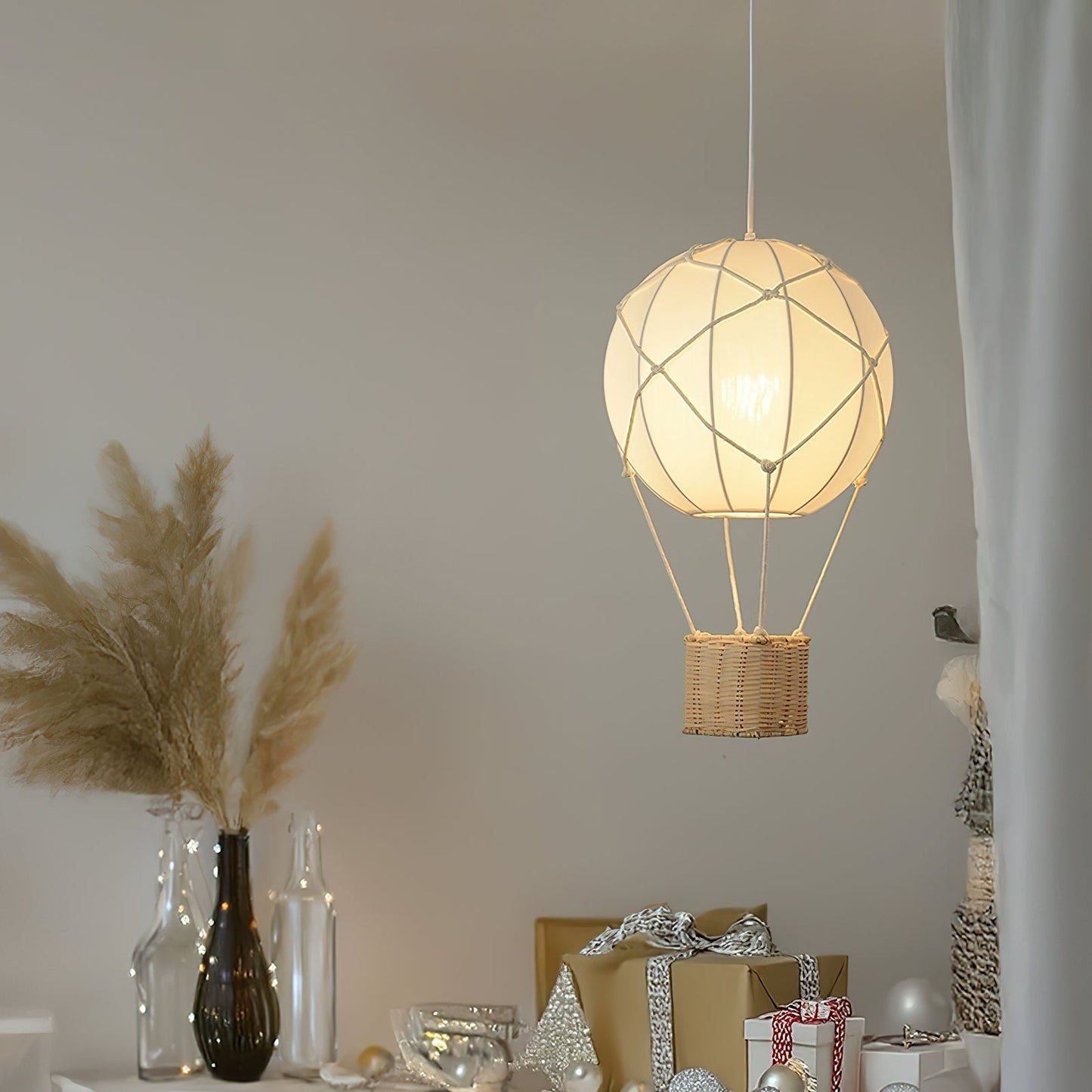 Decorative pendant light with wicker basket design hanging in a room.