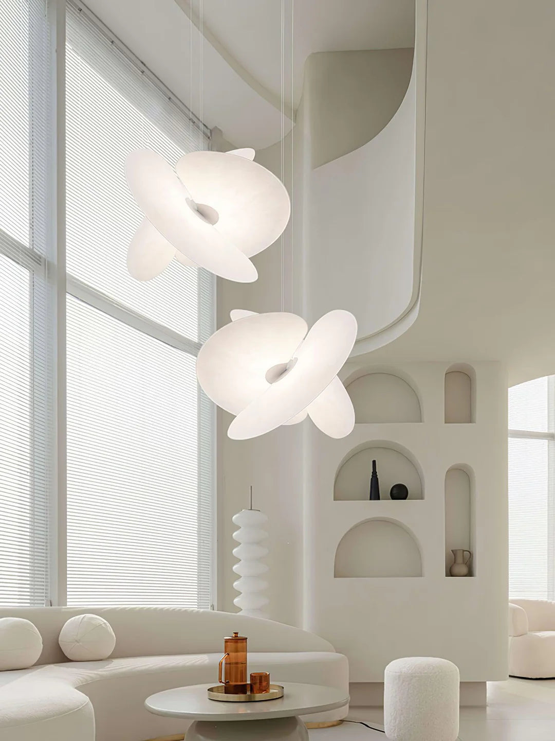 Modern interior with white floral pendant lights and a minimalistic design.