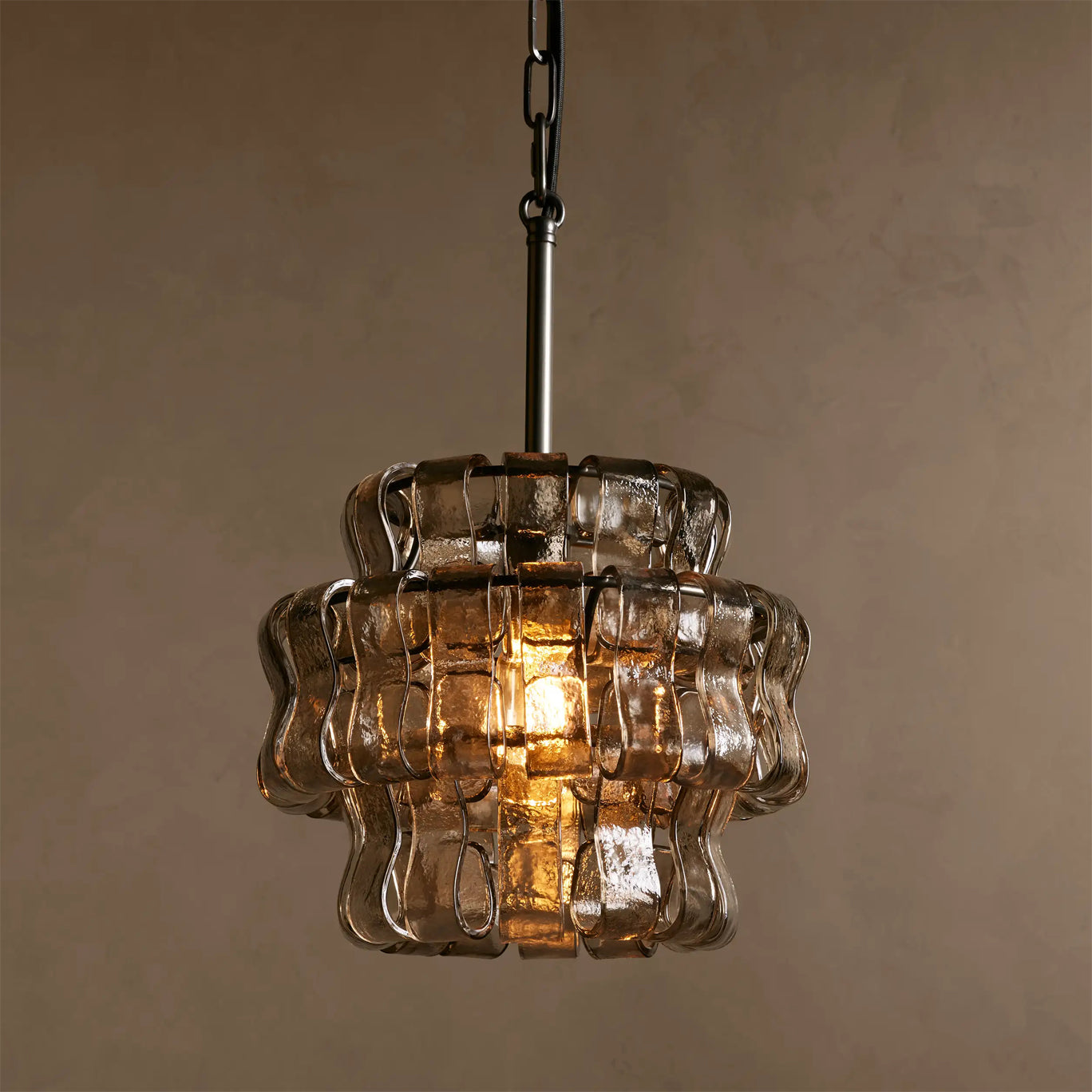 Vintage-style pendant light with wavy glass design on a neutral background