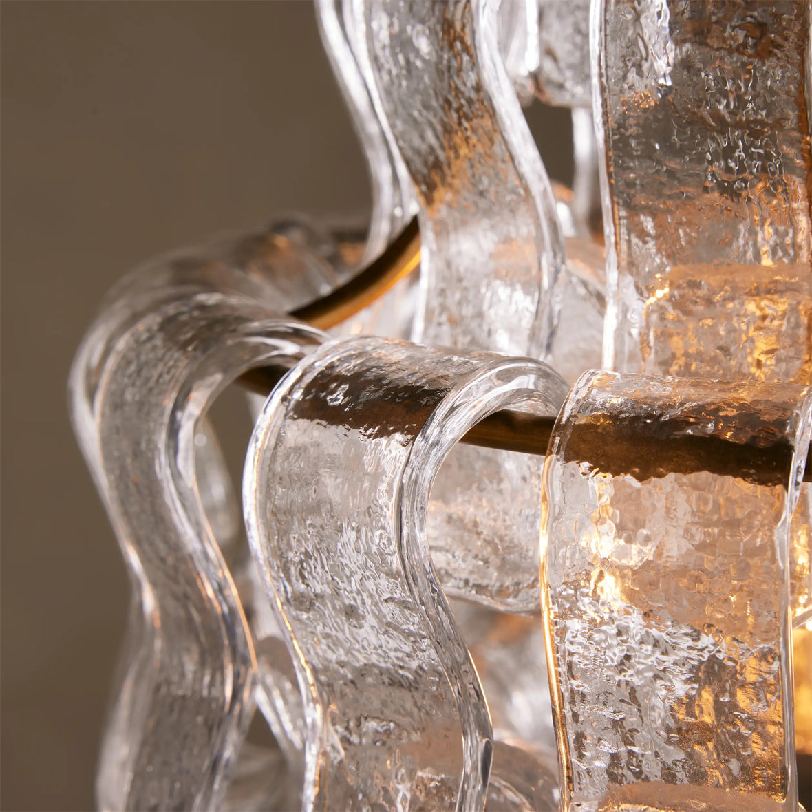 Close-up of a decorative glass fixture with a warm glow