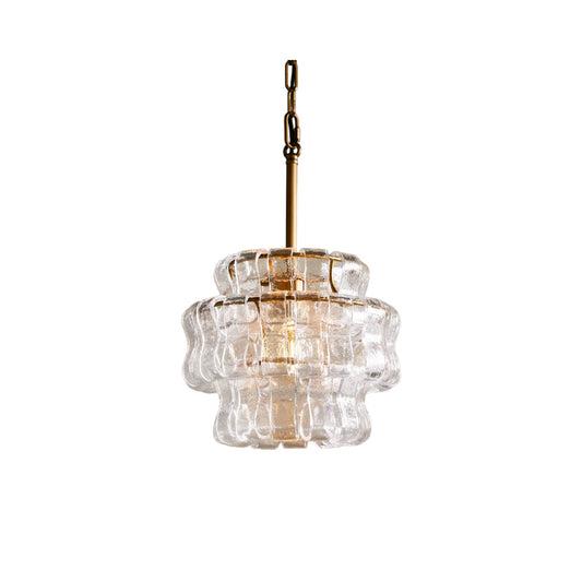 Clear glass pendant light with gold fixture on a white background