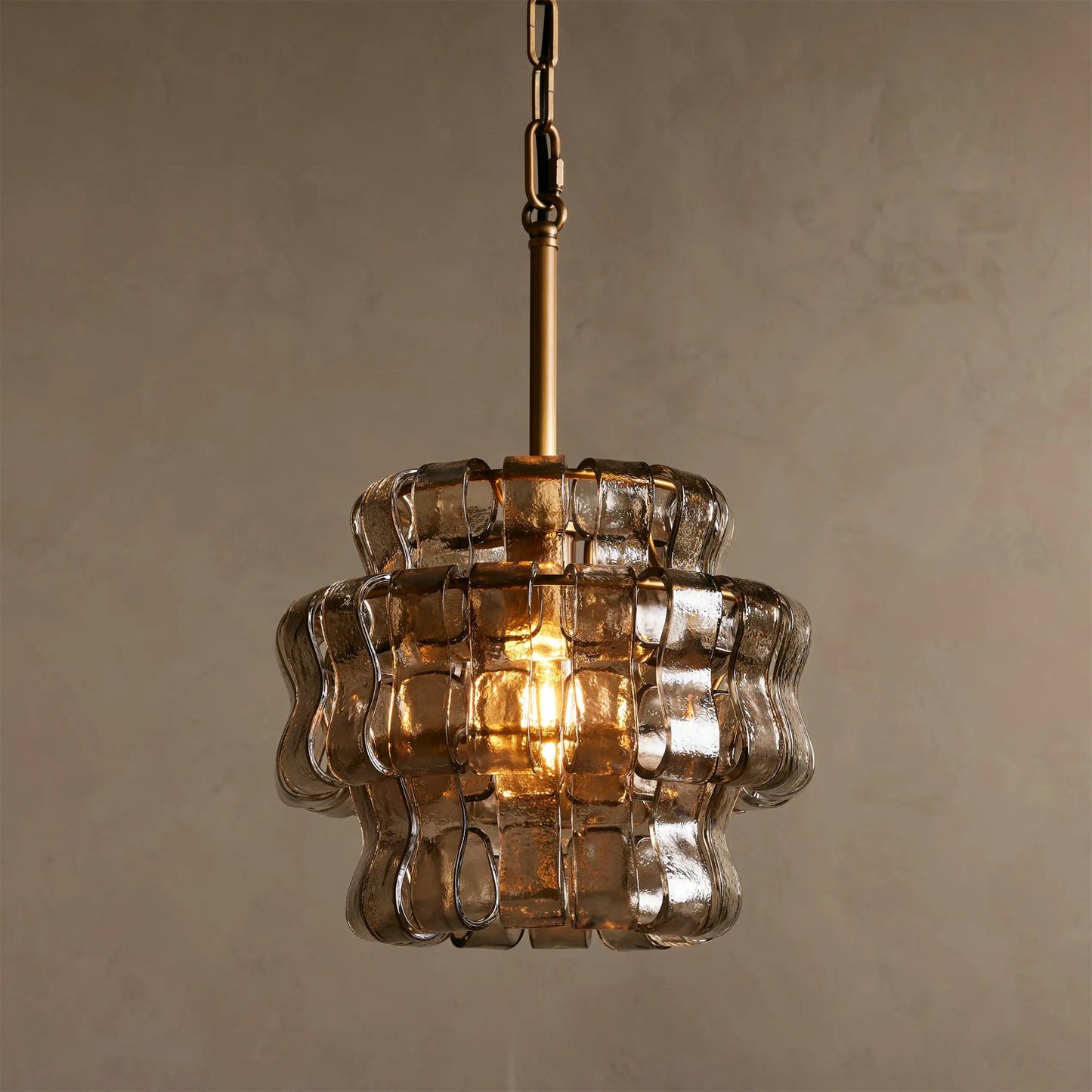 Vintage-style pendant light with textured glass shade on a neutral background