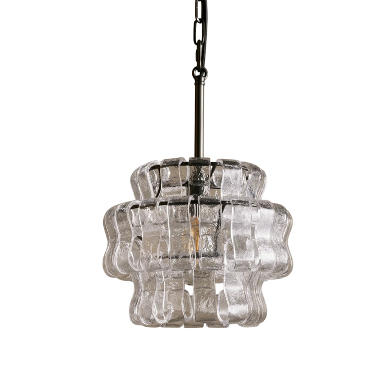 Clear glass pendant light with metal frame on a white background