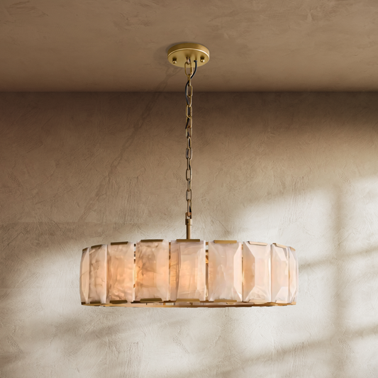 Chandelier with glass shade on a beige wall