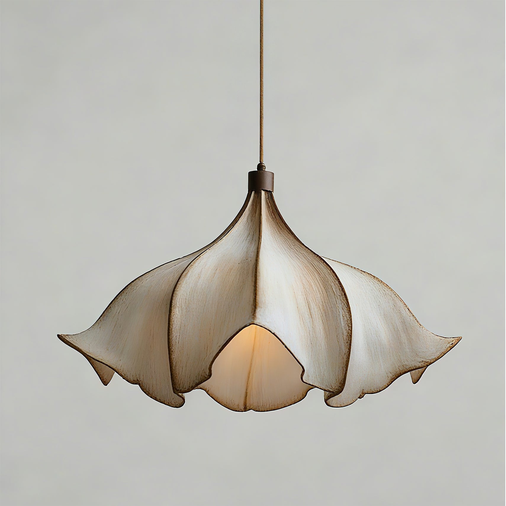 Floral-patterned pendant light on a plain background