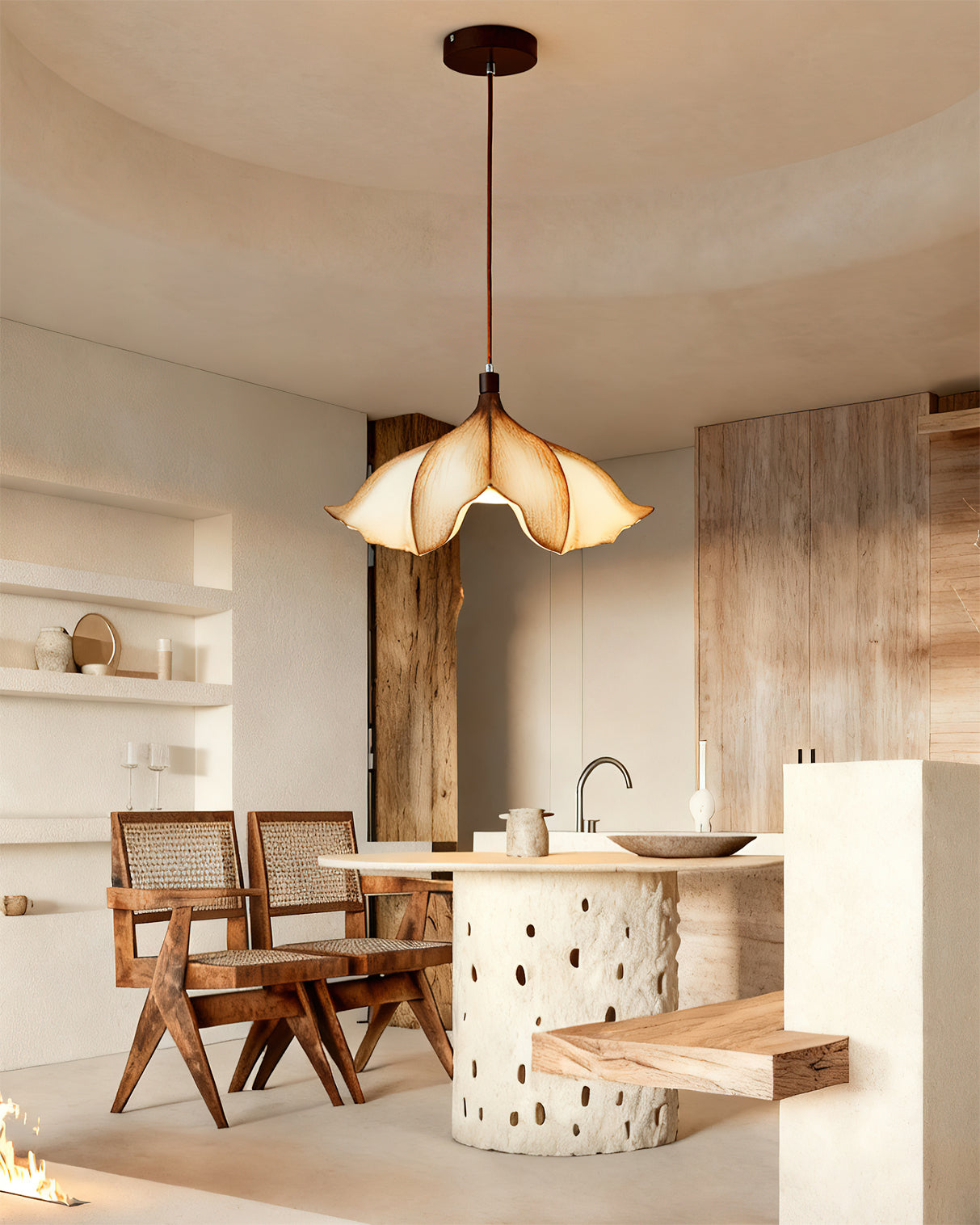 Modern kitchen with pendant light, wooden chairs, and a white island.