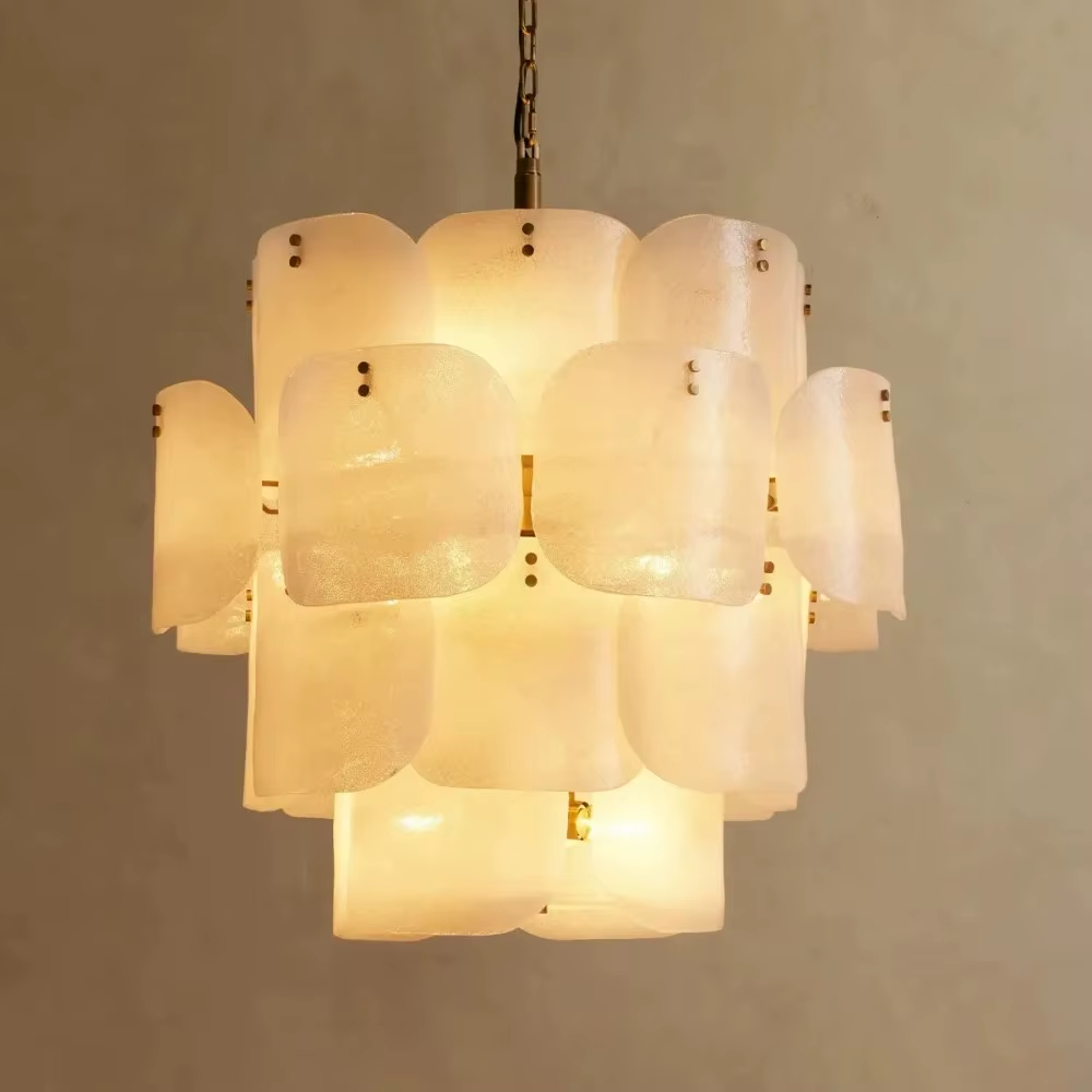 White layered frosted glass chandelier with brass-tone rivet details