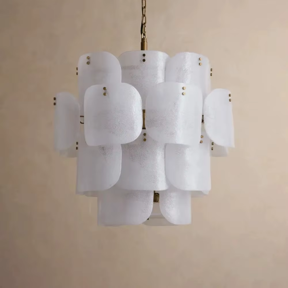 White layered frosted glass chandelier with brass-tone rivet details