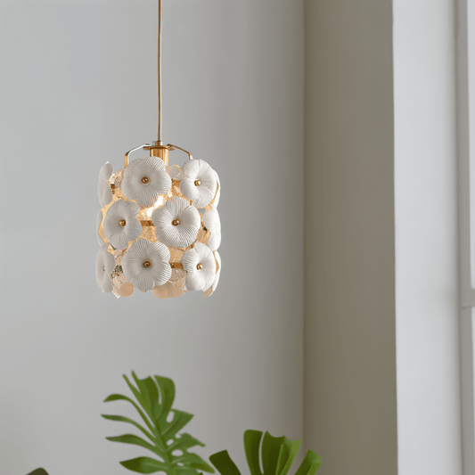 Decorative pendant light with floral design on a neutral background