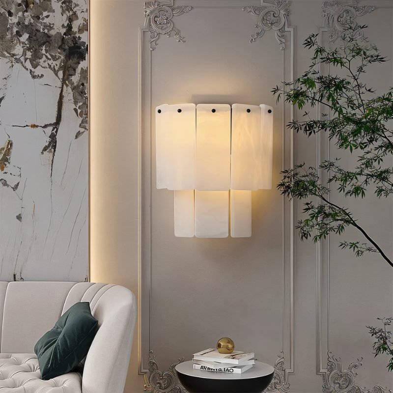 Modern wall sconce in a stylish interior setting with a sofa and decorative elements.