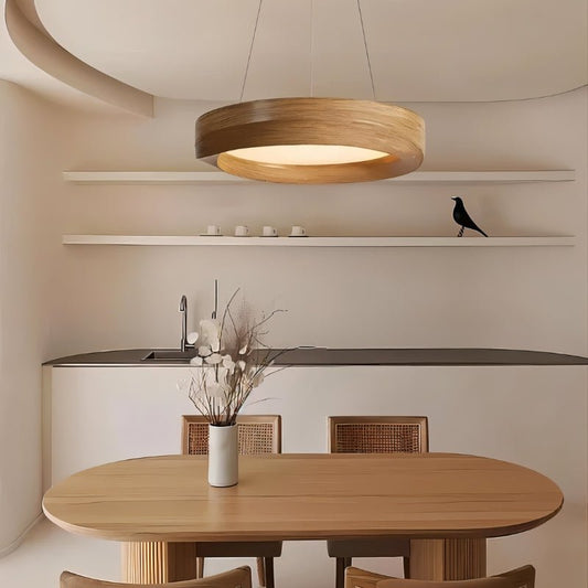 Modern kitchen with wooden dining table and pendant light